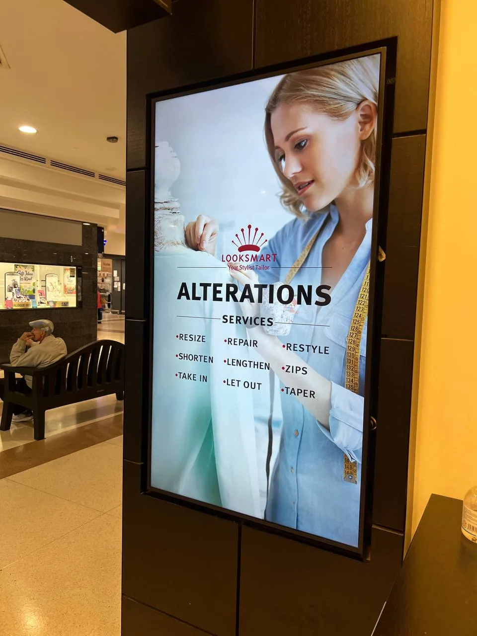 Vertical digital signage screen installed in a Perth shopping centre for Looksmart alterations