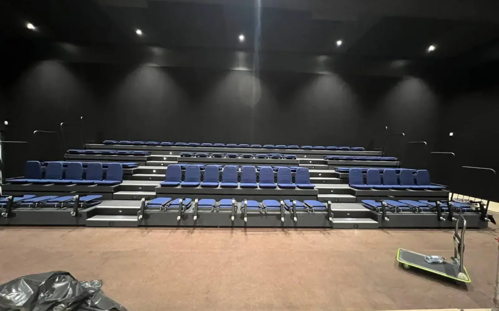 Education auditorium with tiered seating and lighting