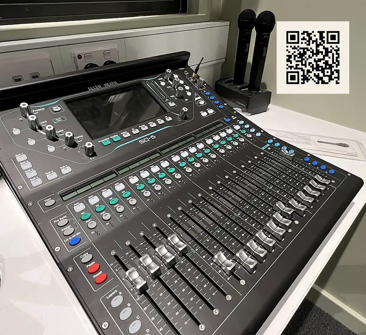 Audio console with QR-linked training access